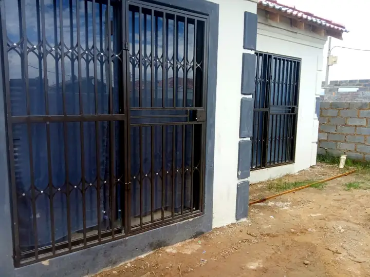 Installed black steel security gate
